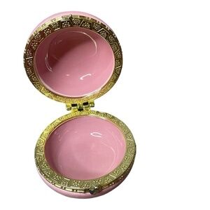pink macaron-shaped box is perfect for storing all your precious jewelry